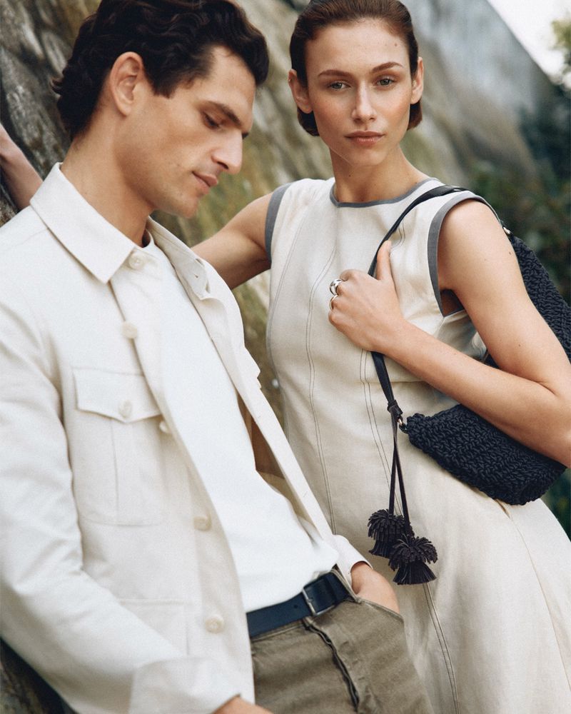 Man and woman posing outdoors against a stone wall for the Pedro del Hierro S/S 26 campaign