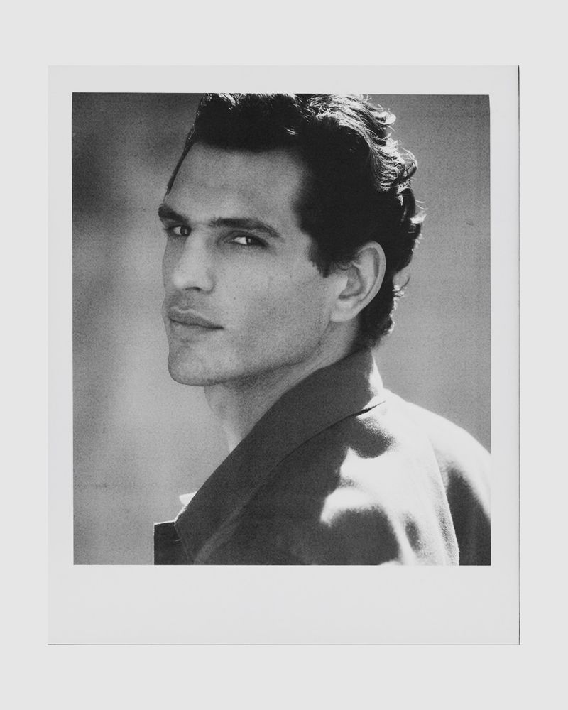 Black and white Polaroid portrait of model Pau Ramis looking over his shoulder in the Pedro del Hierro S/S 26 campaign.