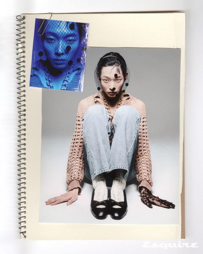 Asian model in light blue jeans, a knitted peach-colored sweater, and black flats, displayed on a sketch pad, with a secondary pinned image.