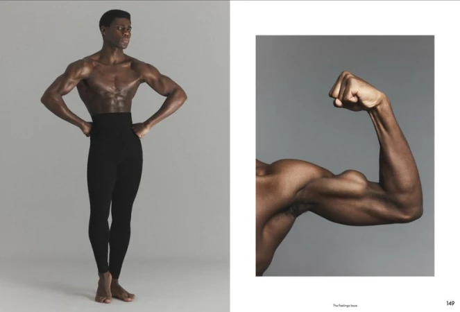 Shirtless black male model wearing high-waisted black trousers posing against a grey studio backdrop