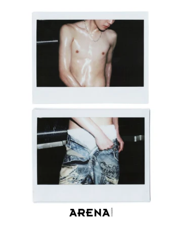 Topless adult male posing in a Polaroid-style close-up, wearing white boxer briefs and printed jeans, against a dark background. 'Arena' logo visible.