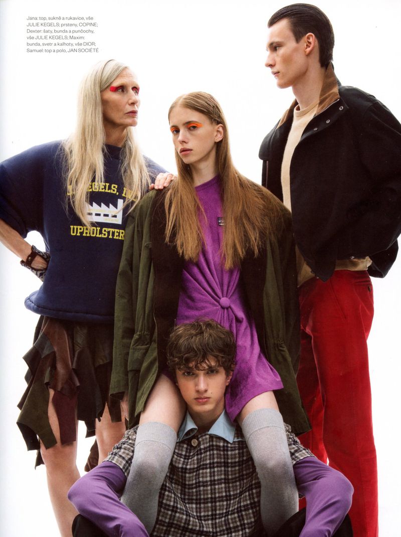 Four fashion models in eclectic designer streetwear posing together against a plain white studio background.