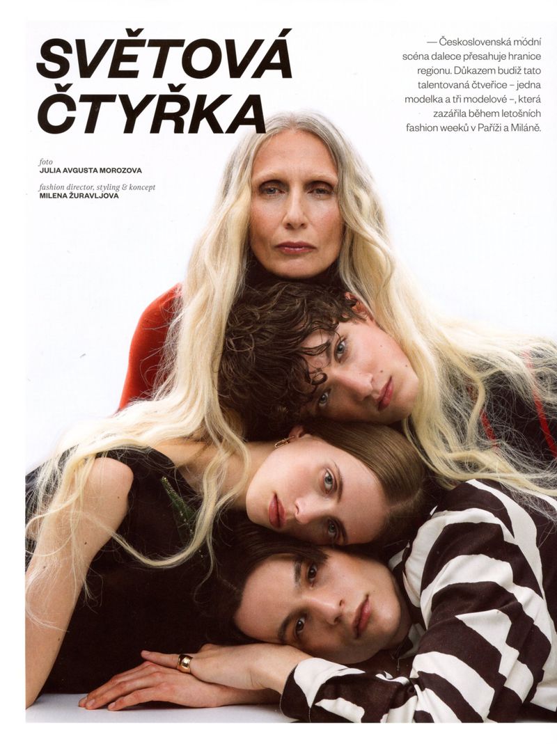 Four models stacked together in a close editorial portrait against a white seamless background for Vogue Czechoslovakia.