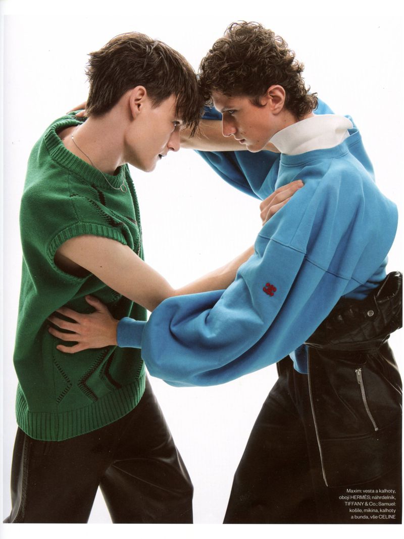 Two male models in colorful sweaters posing closely against a bright white background for Vogue Czechoslovakia