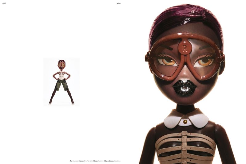 Styled Bratz fashion doll wearing oversized brown goggles and a cage corset top against a white background.