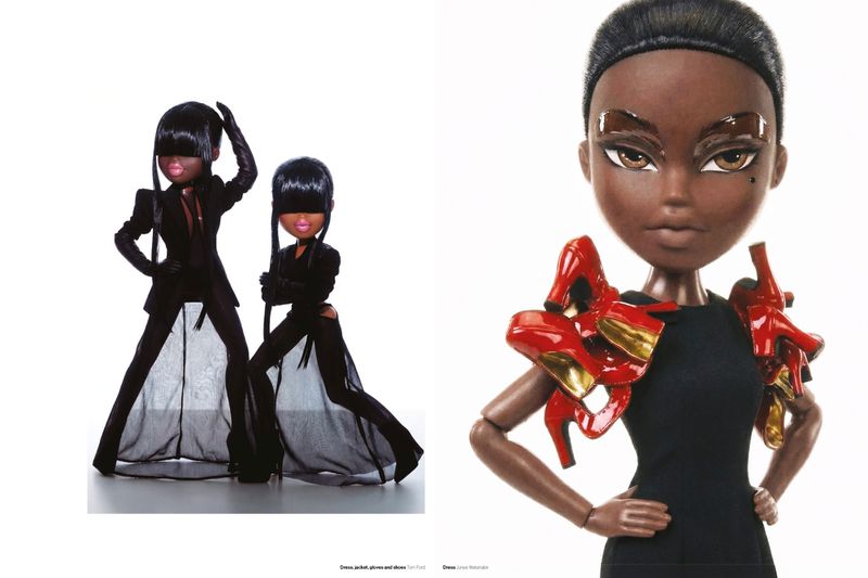 Fashion editorial spread of styled dolls wearing black tailored garments and miniature red high heels on shoulders against white backdrop.