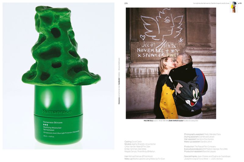 Editorial magazine spread featuring a green skincare jar topped with green sculpture beside a couple kissing in front of chalk wall art.