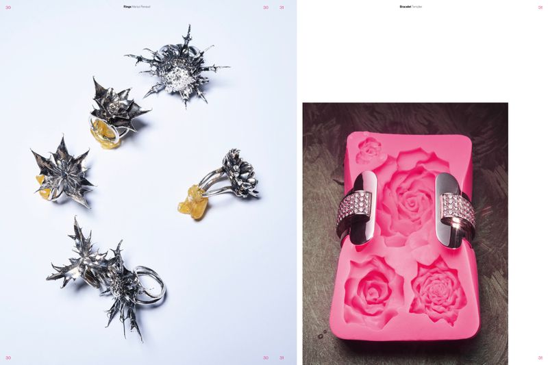 Sculptural spiky silver rings on amber stands paired with a metallic cuff bracelet fitted around a pink rose silicone mold.