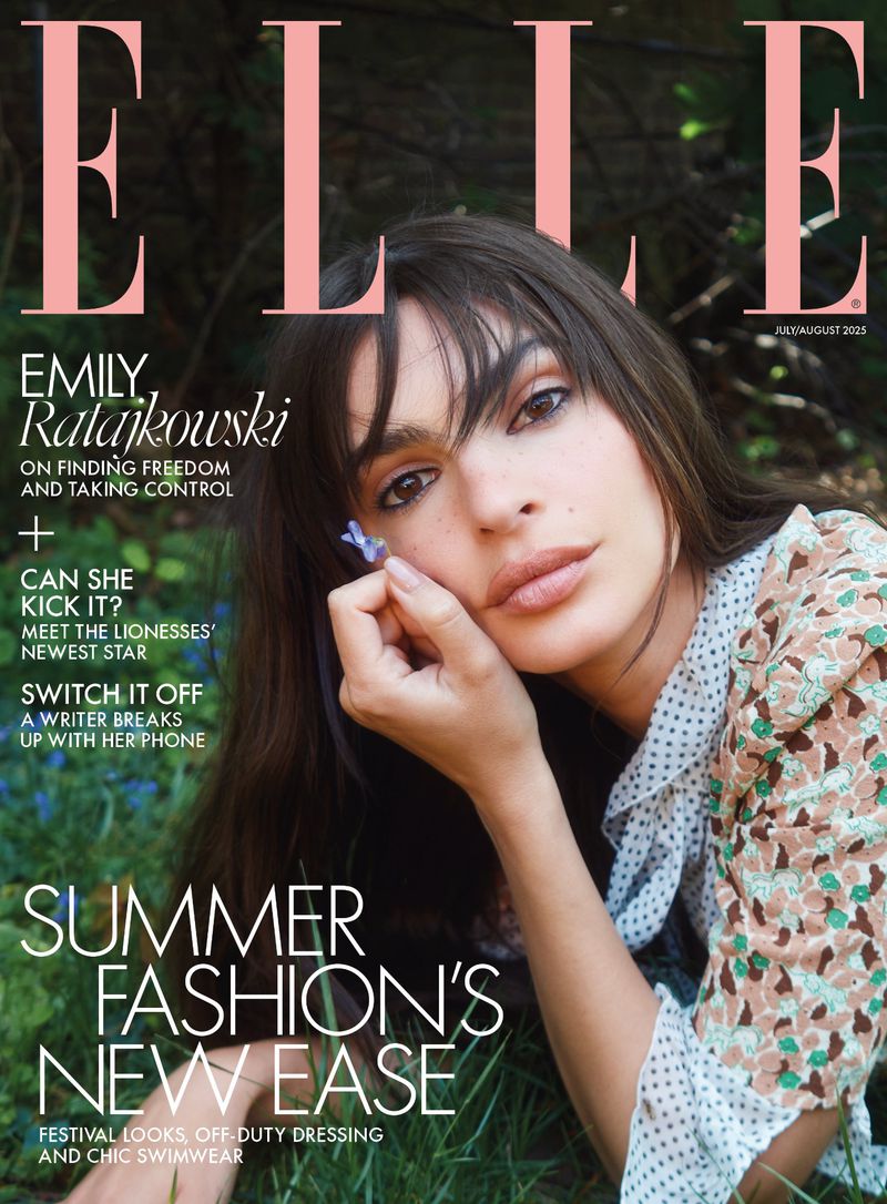 Elle magazine cover featuring model Emily Ratajkowski in a floral dress, holding a small purple flower, set against a blurred greenery backdrop.