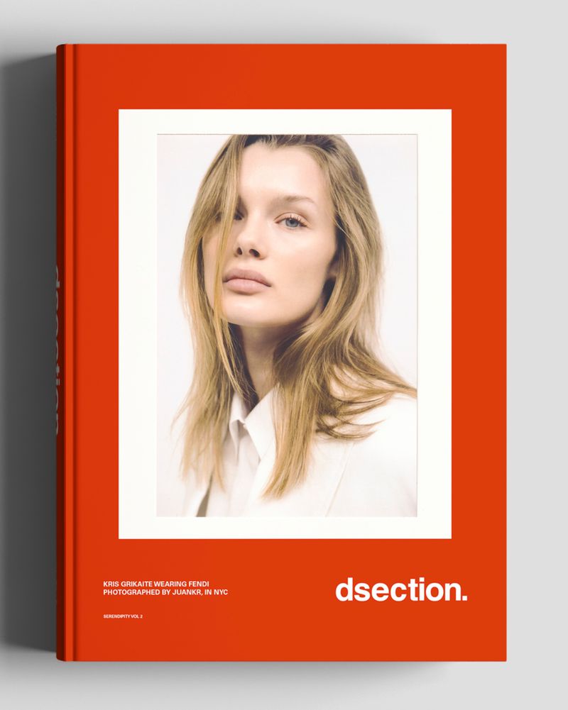 Orange DSECTION magazine cover featuring a portrait photo of model Kris Grikaite wearing white against a pale background.