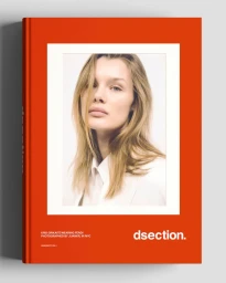 Orange DSECTION magazine cover featuring a portrait photo of model Kris Grikaite wearing white against a pale background.