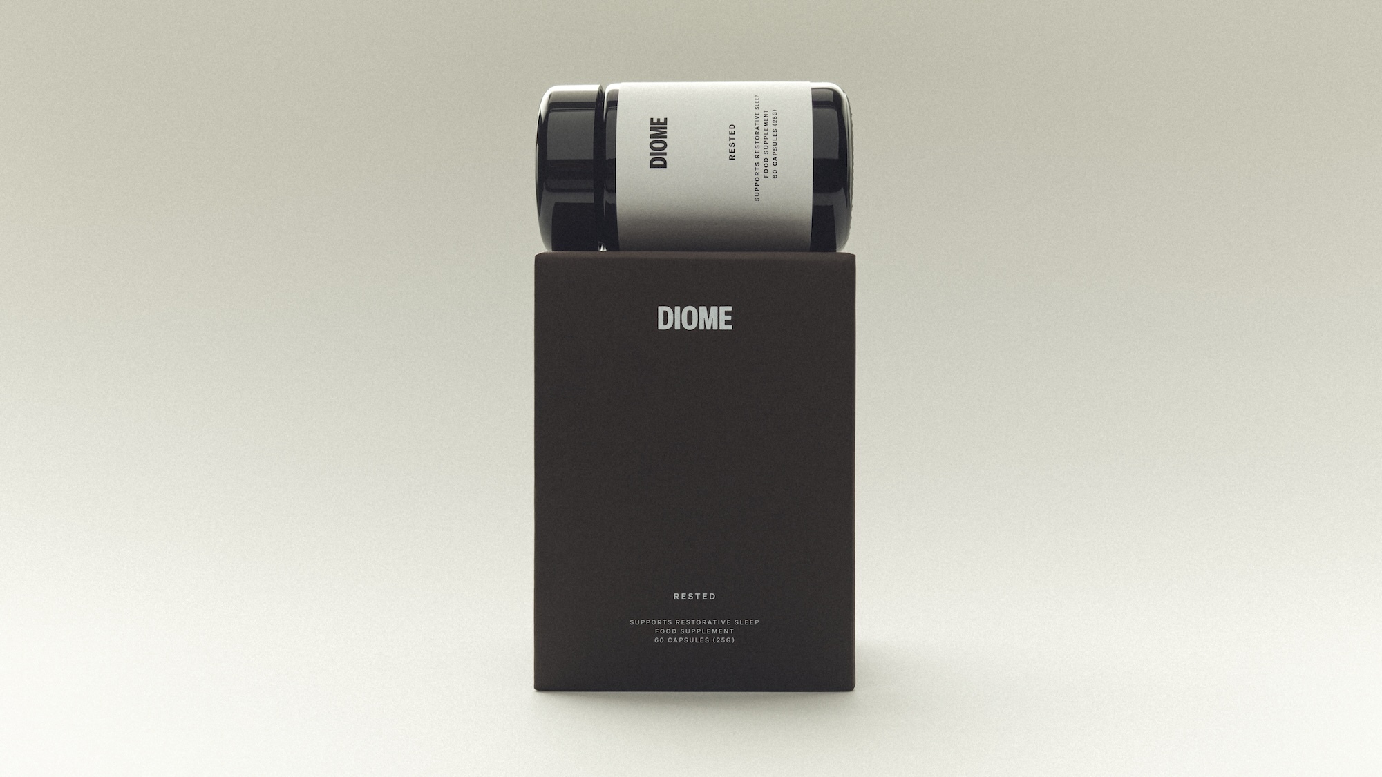 Diome Rested supplement bottle resting horizontally on its dark brown rectangular product box against a pale neutral background.