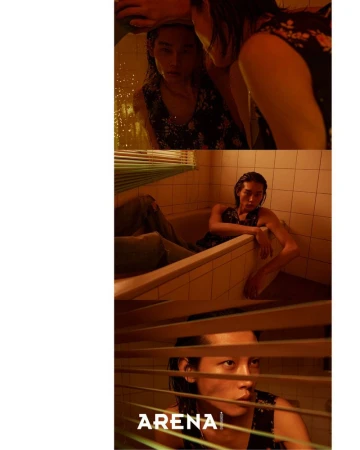 Model Taemin Park in a dark patterned tank top sitting in a tiled bathroom for Arena Homme Korea editorial STICKY NIGHT