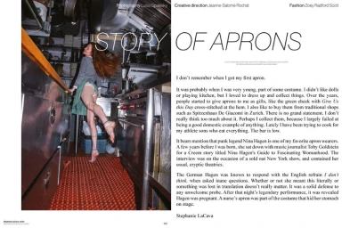 Magazine editorial spread featuring a woman posing dynamically in a green apron and grey sweater inside a commercial kitchen.