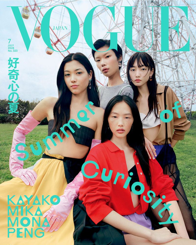 Vogue Japan cover featuring four Asian female fashion models wearing colorful outfits and standing in front of a Ferris wheel.