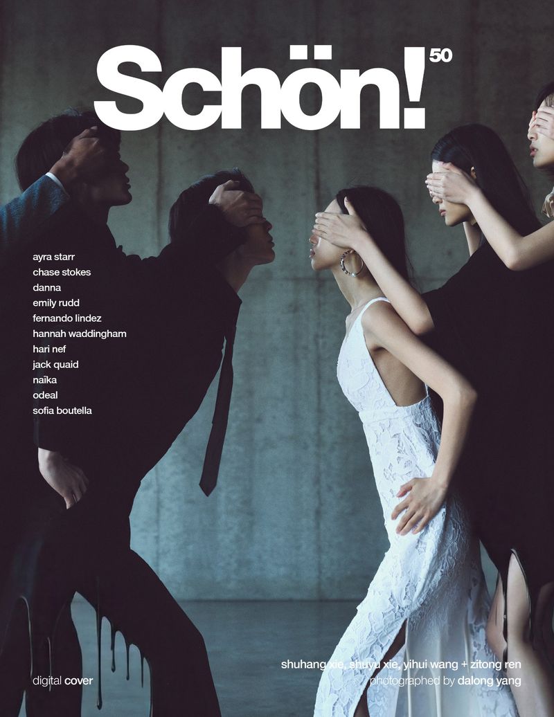 Schön! magazine cover features a woman in a white lace dress, with several people in dark clothing obscuring her eyes and other models.