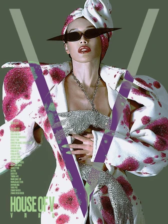 Model wearing an avant-garde white and pink spotted coat and angular sunglasses on a magazine cover.
