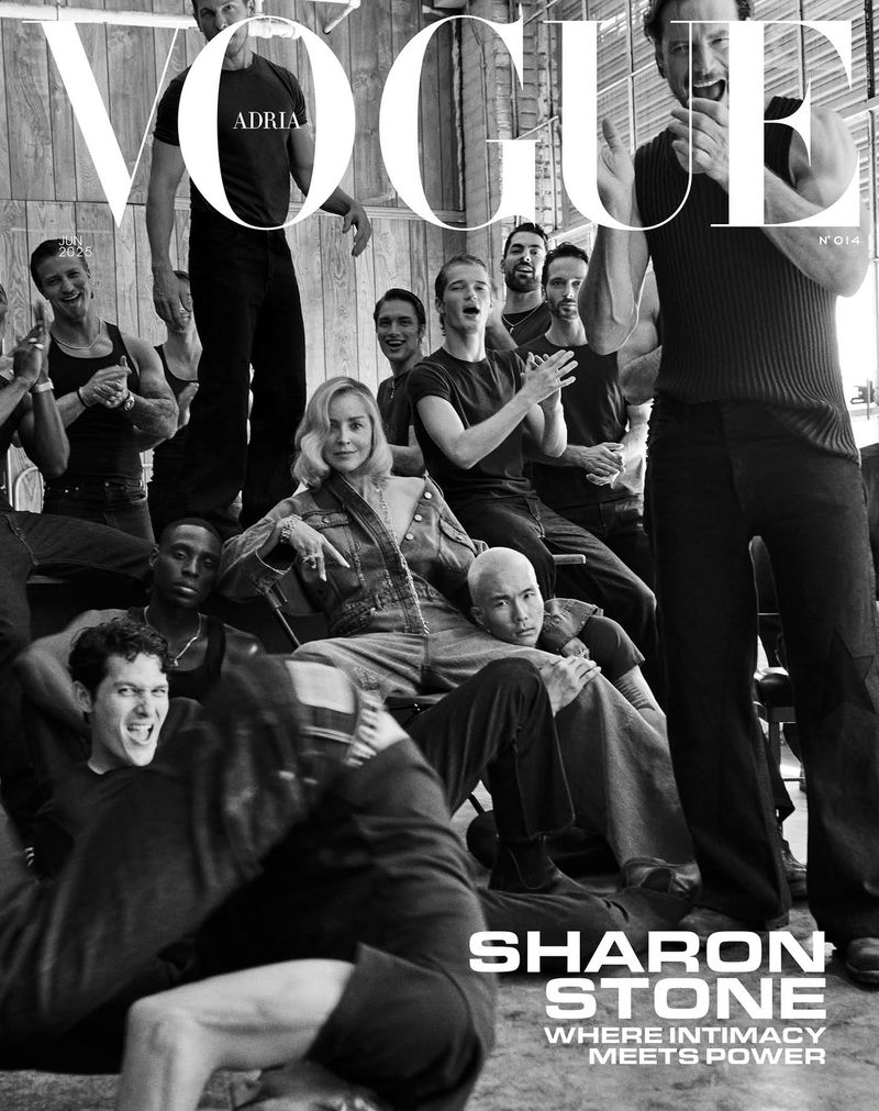Vogue magazine cover featuring Sharon Stone seated among a group of dancers in casual denim and dark clothing against a light backdrop.