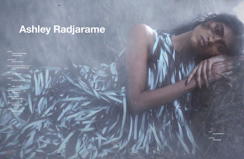 Model Ashley Radjarame reclining outdoors wearing a fringed dress in Numero Netherlands Soft Remains editorial