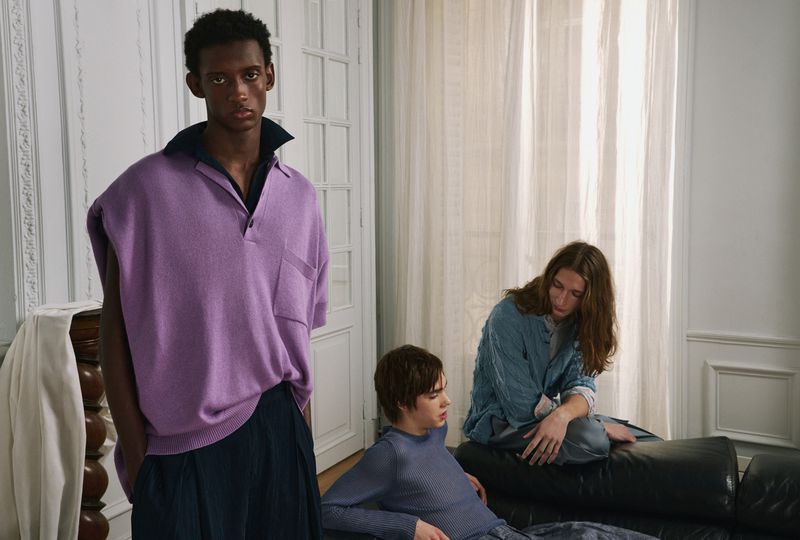 Three male models in an interior setting photographed for AnOther Man editorial by Reto Schmid.