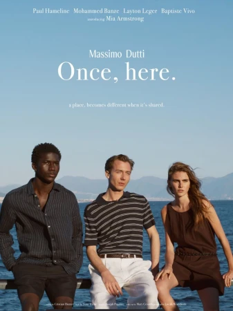 Three models in summer clothing posed outdoors by the sea against a clear blue sky for Massimo Dutti.
