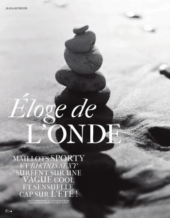 Black and white editorial layout featuring a vertical stack of balanced stones on sand with typography reading Éloge de L'onde.