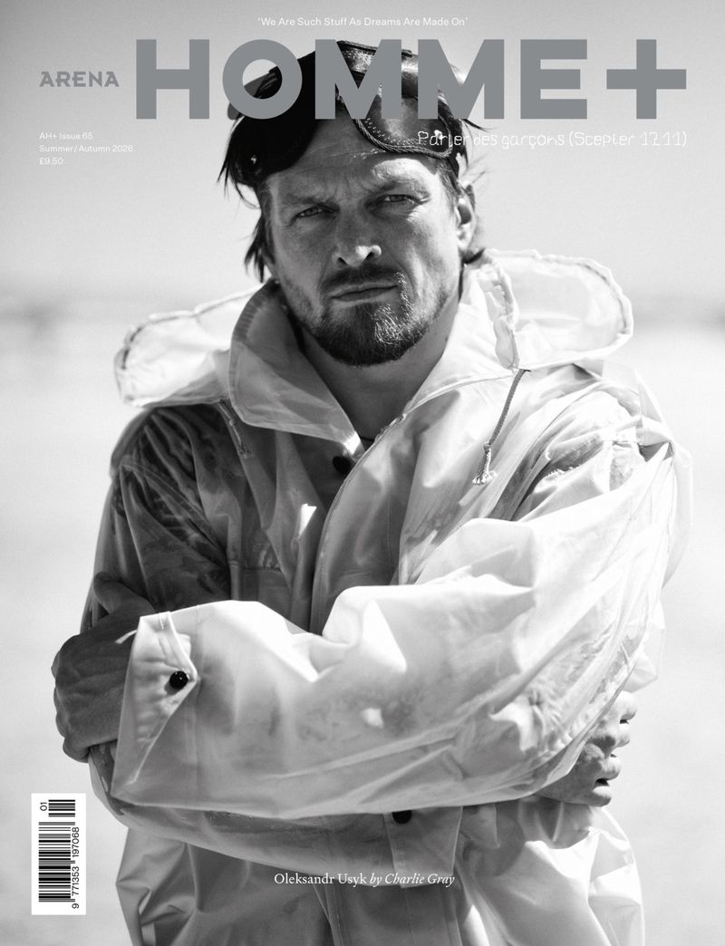 Black and white magazine cover featuring boxer Oleksandr Usyk in a hooded jacket and goggles on his head with arms crossed.