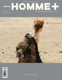 Arena Homme+ magazine cover featuring model Jesse shirtless wearing a draped leopard print jacket in a dry sandy landscape.