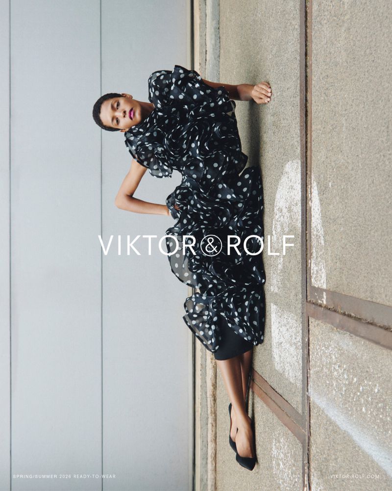 Model Laiza de Moura reclines in a black and white polka dot ruffled dress for the Viktor & Rolf Spring/Summer 2026 campaign.