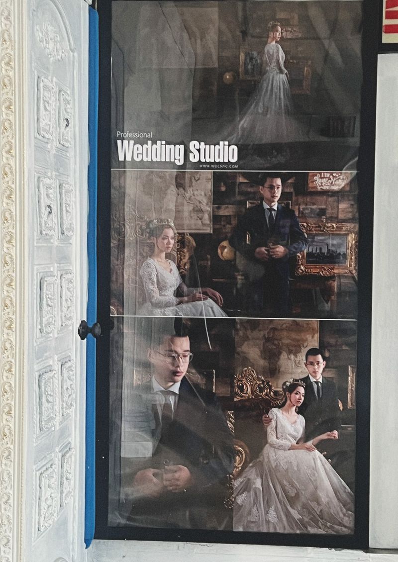 Collage of wedding portraits in a photo studio display with an ornate door on the left, showcasing couples in formal attire and elegant settings.