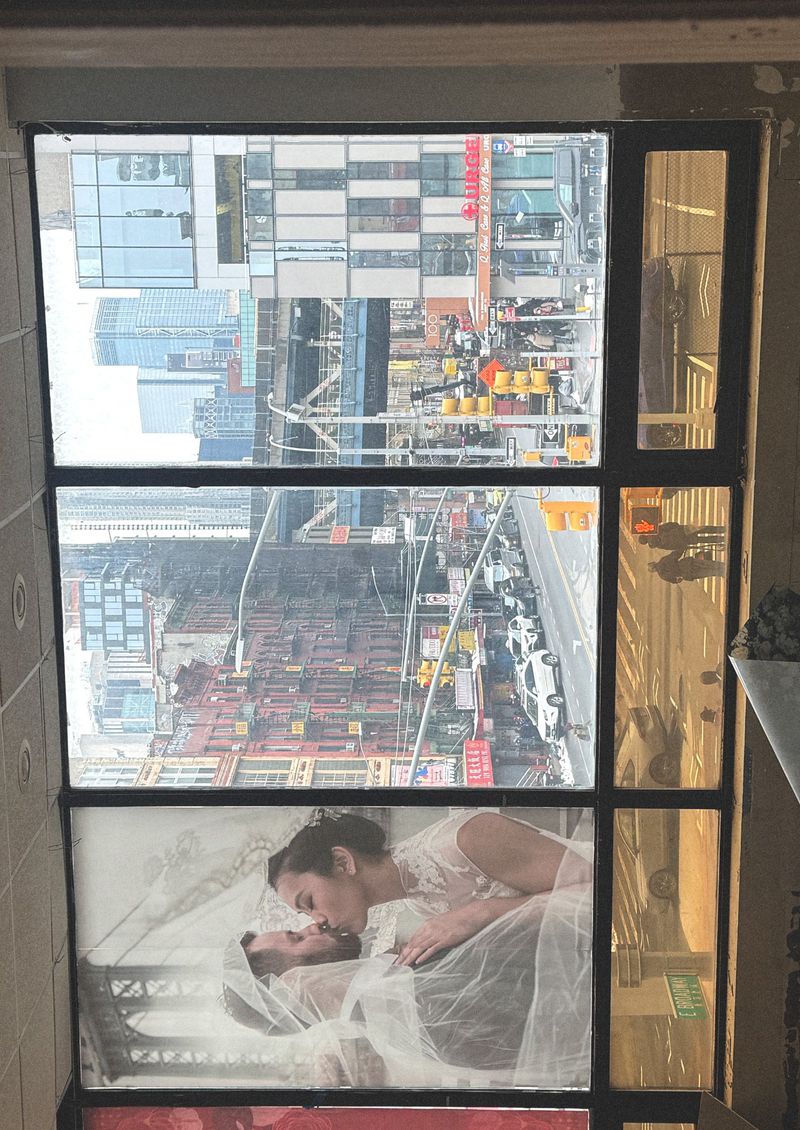A captivating multi-pane window merges a couple's intimate portrait with a bustling city skyline, creating a striking contrast.