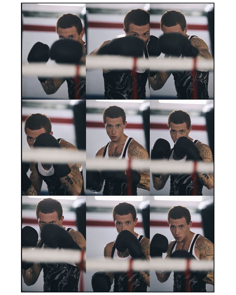 A nine-panel photo grid showing a tattooed male boxer wearing black gloves posing behind boxing ring ropes.