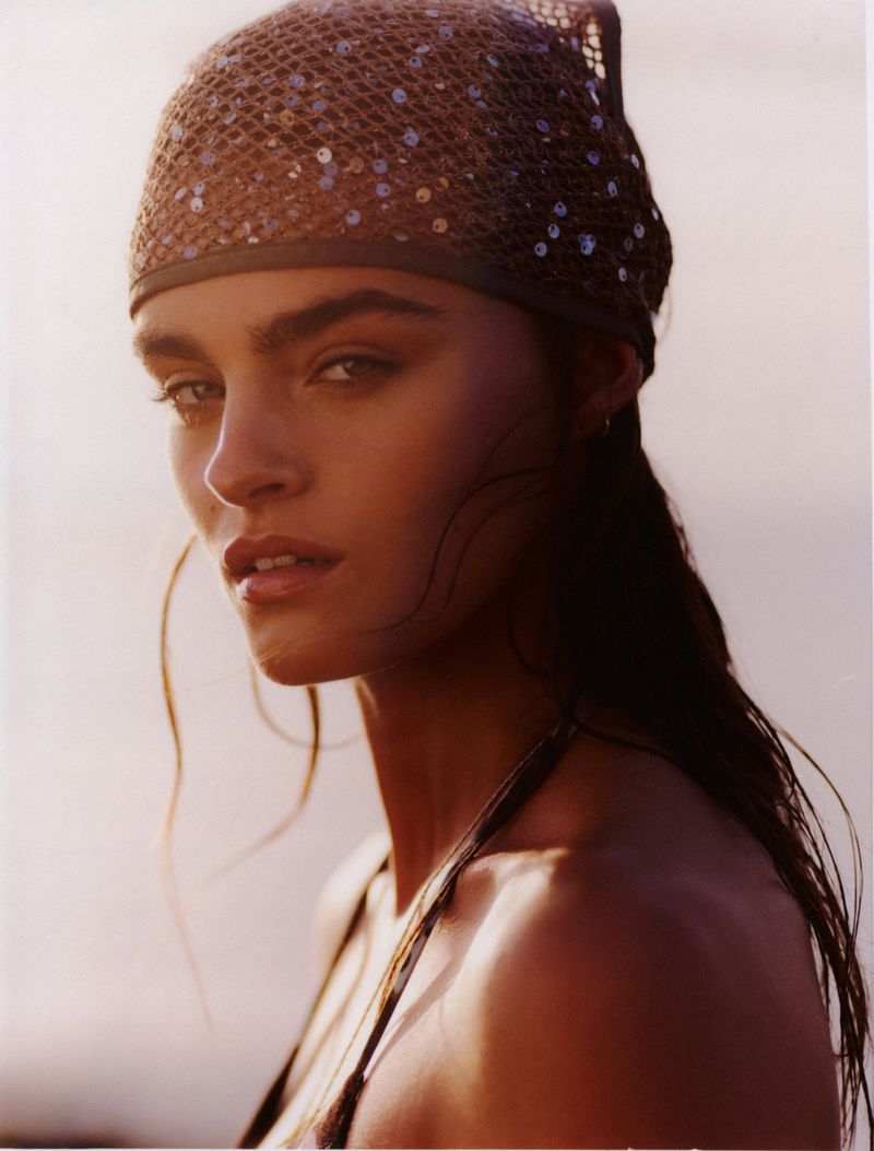 Anna Pricope wearing a sequined mesh bandana headscarf in a close-up portrait in warm sunlight.