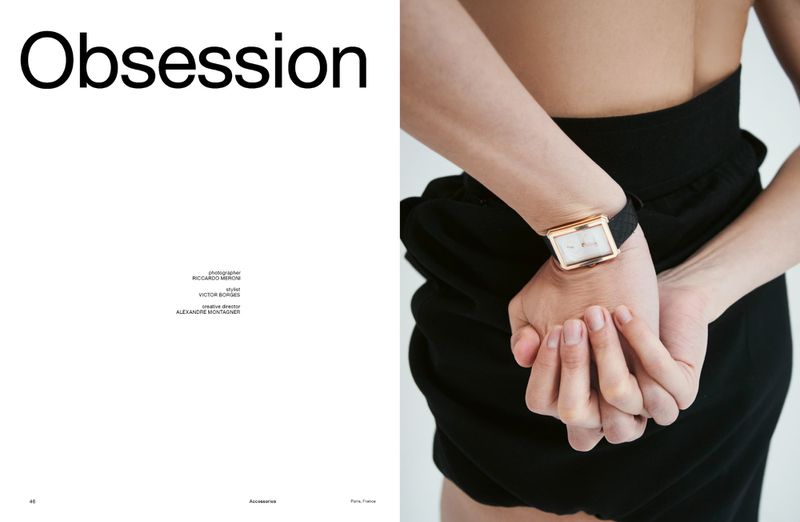 Editorial magazine layout titled Obsession featuring a close-up of hands wearing a rectangular gold wristwatch with a black strap.