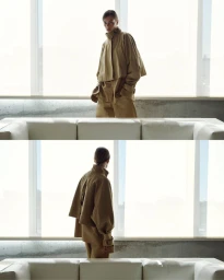Model wearing a camel cropped jacket and matching trousers in a two-panel fashion lookbook portrait behind a white sofa.