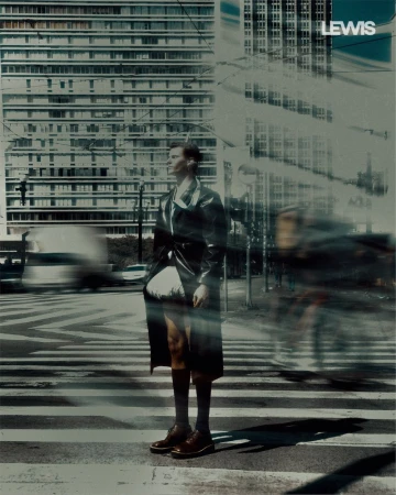 Fashion model in a long dark coat and knee socks standing on a city crosswalk with motion blur overlays.