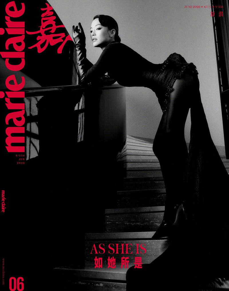 Actor Shu Qi wearing a black dress and opera gloves poses on a staircase for Marie Claire China cover shoot.