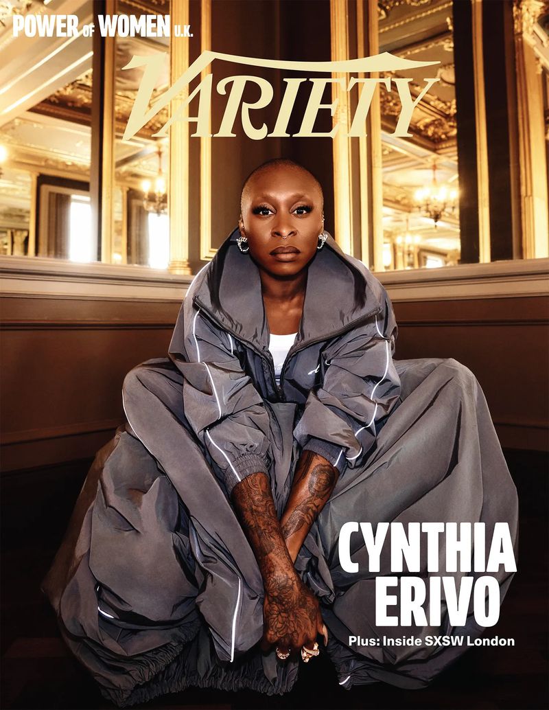 Cynthia Erivo wearing a grey oversized tracksuit seated against an ornate gilded interior background for Variety Magazine.