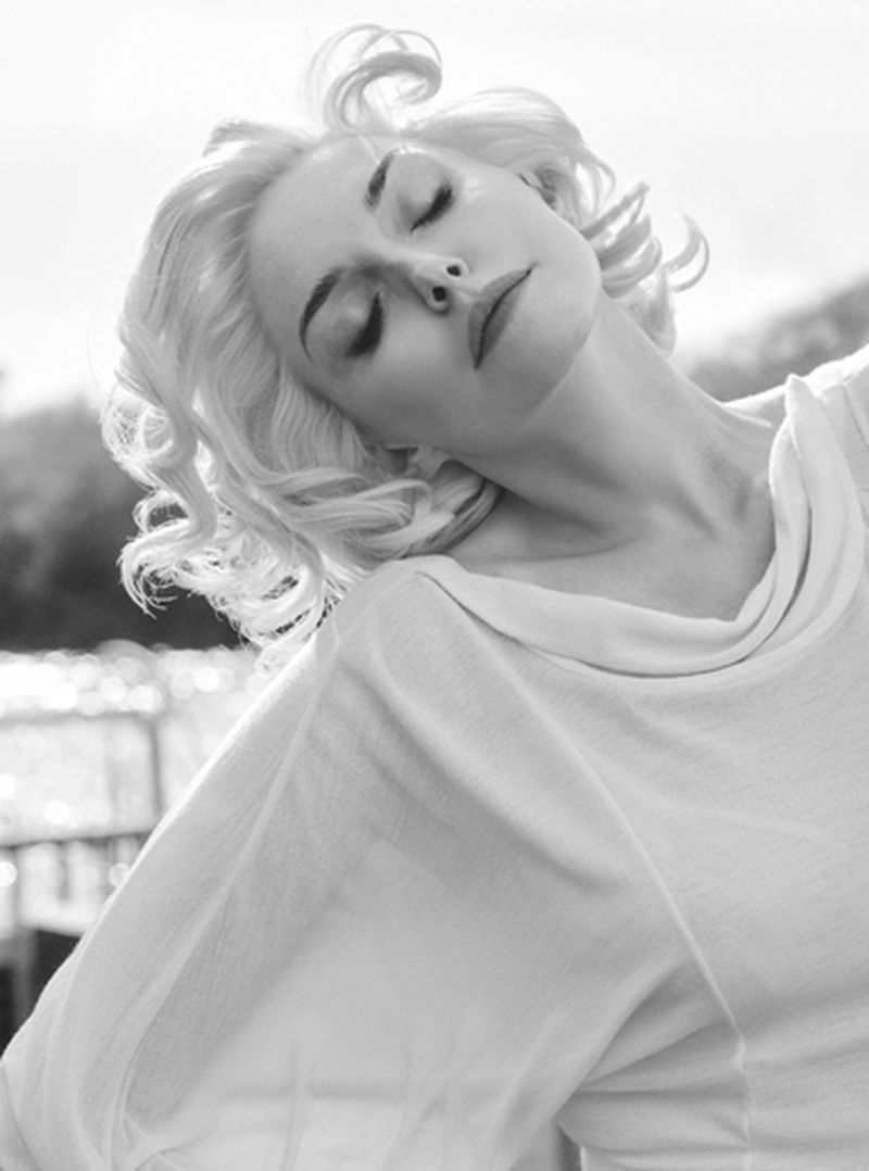 Black and white portrait of model Sophie Dahl with styled blonde hair wearing a white top for Harper's Bazaar UK