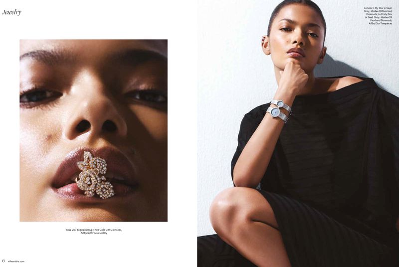 A woman showcases fine jewelry, including a rose ring in pink gold with diamonds and wristwatches, in a studio shot for a fashion editorial.