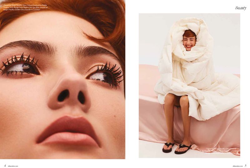 Beauty editorial featuring a redhead woman in a white blanket, with a close-up of a model's eye with long lashes and clear skin.