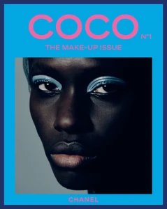 Close-up portrait of a model with blue eye makeup featured on Chanel Coco Magazine Issue No. 1 cover.