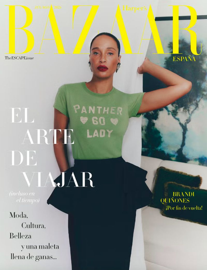 Bazaar Espana magazine cover featuring a stylish adult female with a green t-shirt and black skirt indoors against a white wall.