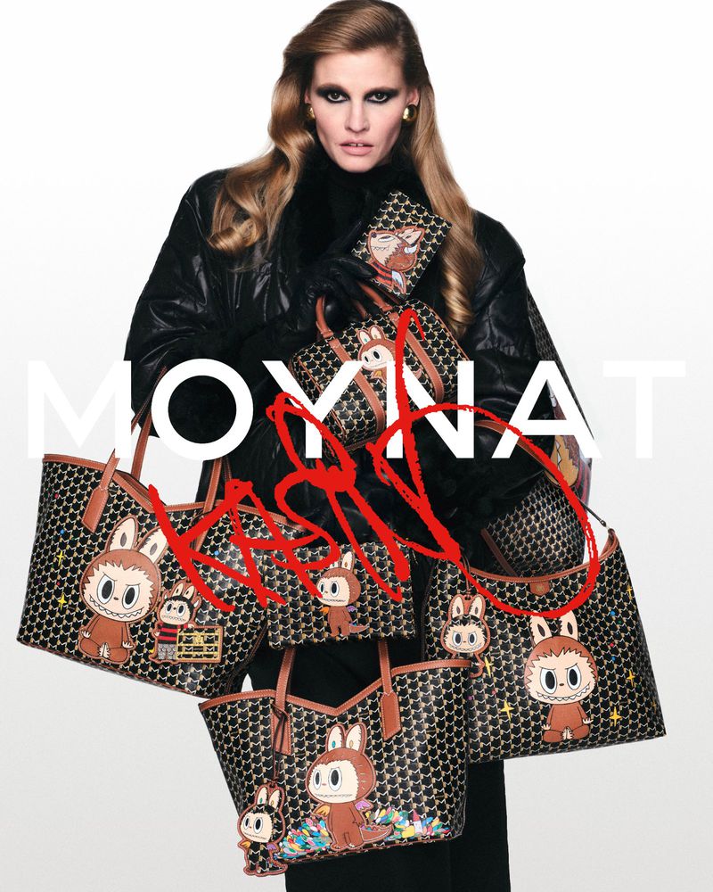 Model Lara Stone holding multiple Moynat handbags with Kasing Lung character prints against a white background.