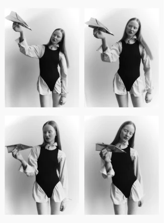 Four-panel black and white editorial contact sheet featuring a model holding a paper airplane in a white studio setting.