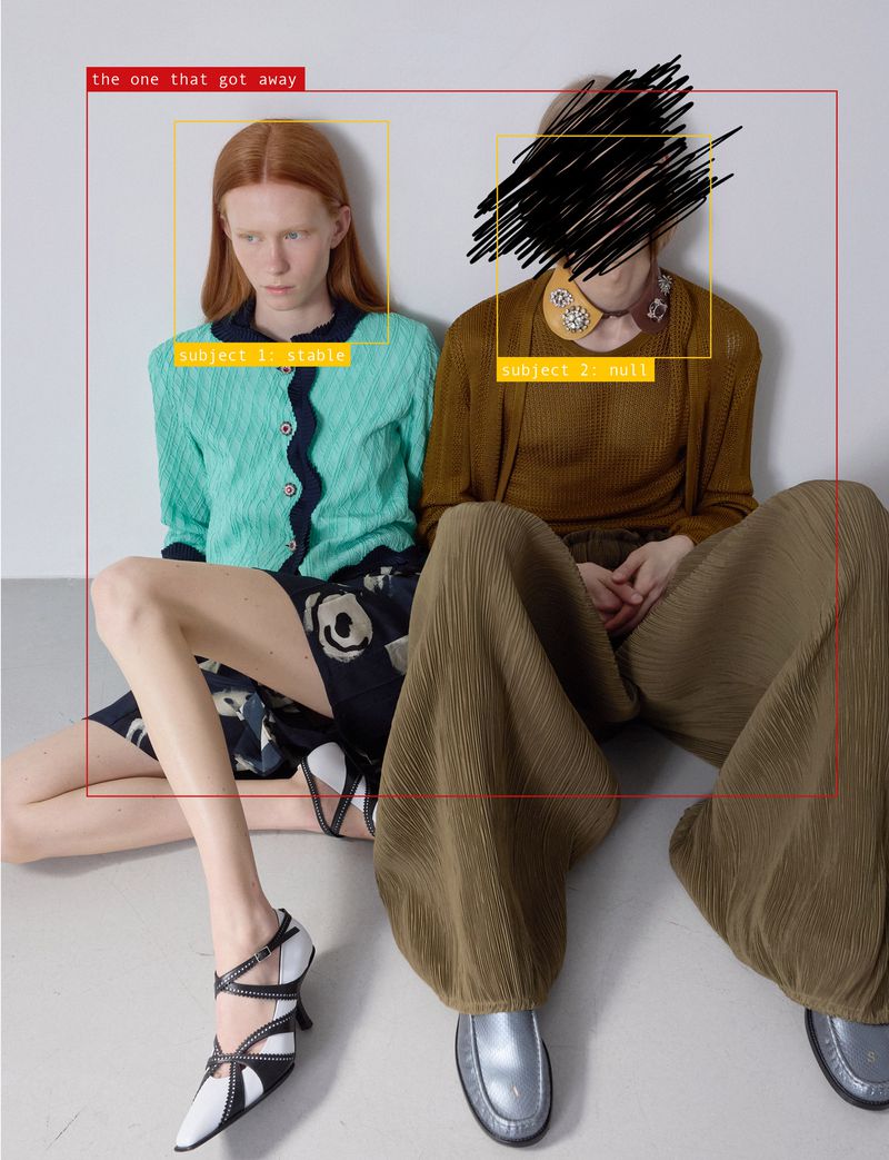 Two fashion models seated on the floor in knitwear and wide-leg trousers against a neutral studio backdrop with graphic UI overlays.