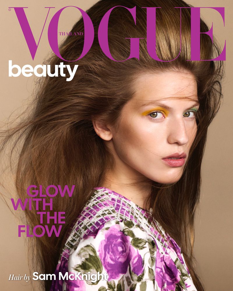 Model Carolina Mendillo with voluminous hair and a floral top for Vogue Thailand Beauty cover.