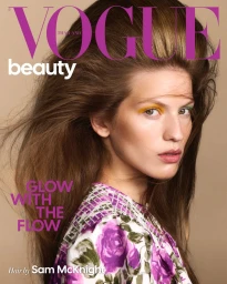 Model Carolina Mendillo with voluminous hair and a floral top for Vogue Thailand Beauty cover.