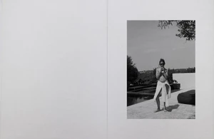 Monochrome editorial spread of a woman in sunglasses standing poolside wrapped in a white towel on a sunny terrace.