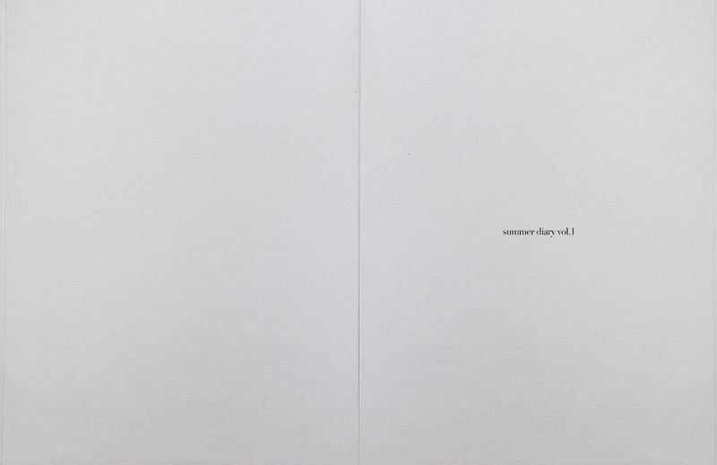 Minimalist open publication spread on off-white paper with small lowercase typography reading summer diary vol. 1 on the right page.